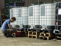 A man collects water in Glucholazy, Poland, on September 20, 2024. (