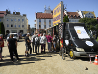 People queue for food at a World Central Kitchen truck in Glucholazy, Poland, on September 20, 2024. (