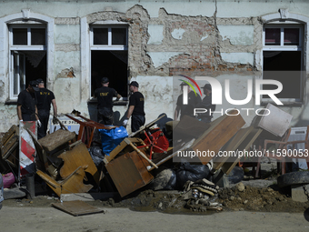 Firefighters clean the flooding aftermath in Glucholazy, Poland, on September 20, 2024. (