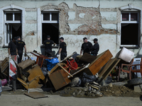 Firefighters clean the flooding aftermath in Glucholazy, Poland, on September 20, 2024. (