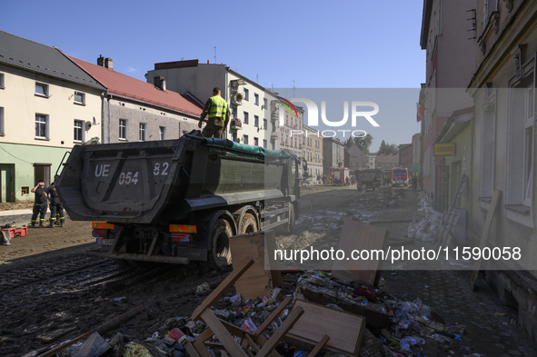 Members of the Polish armed forces and firefighters clean the flooding aftermath in Glucholazy, Poland, on September 20, 2024. 