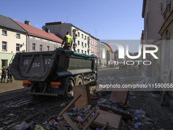 Members of the Polish armed forces and firefighters clean the flooding aftermath in Glucholazy, Poland, on September 20, 2024. (