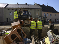 Members of the Polish armed forces help clean the flooding aftermath in Glucholazy, Poland, on September 20, 2024. (