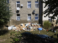 Furniture and other goods amass against a house in the flood-hit town of Glucholazy, Poland, on September 20, 2024. (