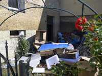 Furniture and other goods amass against a house in the flood-hit town of Glucholazy, Poland, on September 20, 2024. (