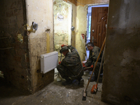 Members of the Polish armed forces clean up a house after the flood in Glucholazy, Poland, on September 20, 2024. (