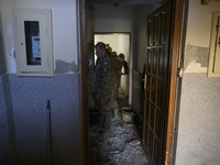 Members of the Polish armed forces clean up a house after the flood in Glucholazy, Poland, on September 20, 2024. (