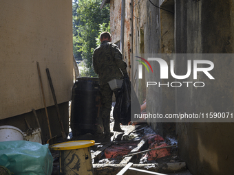 Members of the Polish armed forces remove debris from flood-hit houses in Glucholazy, Poland, on September 20, 2024. (