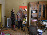 People clean up their apartment after the flood in Glucholazy, Poland, on September 20, 2024. (