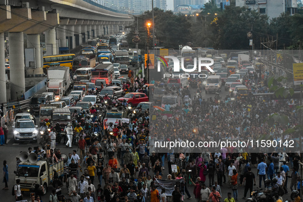 Various citizen organizations take out a torch rally in Kolkata, India, on September 20, 2024, in protest against the rape and murder of a s...