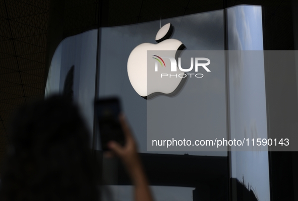 The Apple logo is seen on the launch day of the iPhone 16 series at Apple BKC, in Mumbai, India, on September 20, 2024. The highly awaited i...