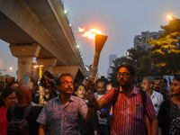 Various citizen organizations take out a torch rally in Kolkata, India, on September 20, 2024, in protest against the rape and murder of a s...