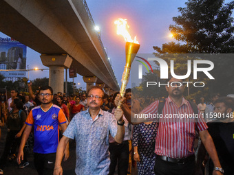 Various citizen organizations take out a torch rally in Kolkata, India, on September 20, 2024, in protest against the rape and murder of a s...