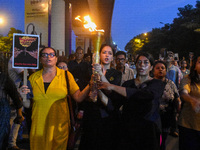 Various citizen organizations take out a torch rally in Kolkata, India, on September 20, 2024, in protest against the rape and murder of a s...