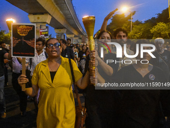 Various citizen organizations take out a torch rally in Kolkata, India, on September 20, 2024, in protest against the rape and murder of a s...