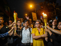 Various citizen organizations take out a torch rally in Kolkata, India, on September 20, 2024, in protest against the rape and murder of a s...