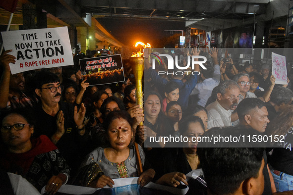 Various citizen organizations take out a torch rally in Kolkata, India, on September 20, 2024, in protest against the rape and murder of a s...