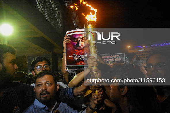 Various citizen organizations take out a torch rally in Kolkata, India, on September 20, 2024, in protest against the rape and murder of a s...