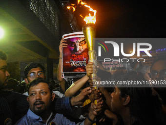 Various citizen organizations take out a torch rally in Kolkata, India, on September 20, 2024, in protest against the rape and murder of a s...