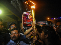 Various citizen organizations take out a torch rally in Kolkata, India, on September 20, 2024, in protest against the rape and murder of a s...