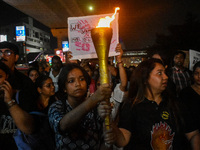 Various citizen organizations take out a torch rally in Kolkata, India, on September 20, 2024, in protest against the rape and murder of a s...