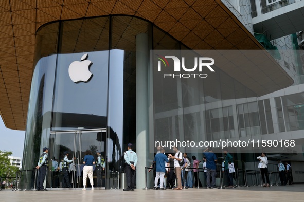 Customers stand in line on the launch day of the iPhone 16 series at Apple BKC, in Mumbai, India, on September 20, 2024. The iPhone 16 serie...