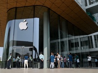 Customers stand in line on the launch day of the iPhone 16 series at Apple BKC, in Mumbai, India, on September 20, 2024. The iPhone 16 serie...