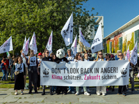 Protesters march during the global climate strike organized by Fridays for Future in Berlin, Germany, on September 20, 2024 (