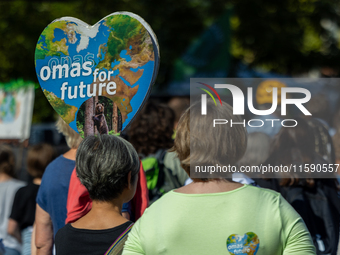 Protesters march during the global climate strike organized by Fridays for Future in Berlin, Germany, on September 20, 2024 (