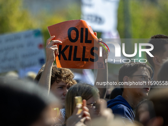 Protesters march during the global climate strike organized by Fridays for Future in Berlin, Germany, on September 20, 2024 (