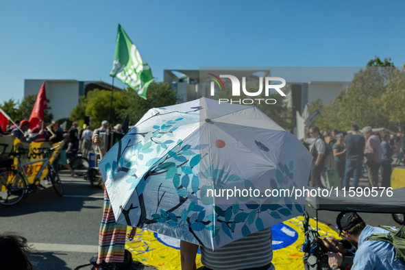 Protesters march during the global climate strike organized by Fridays for Future in Berlin, Germany, on September 20, 2024 