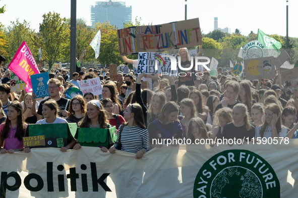 Protesters march during the global climate strike organized by Fridays for Future in Berlin, Germany, on September 20, 2024 