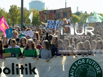 Protesters march during the global climate strike organized by Fridays for Future in Berlin, Germany, on September 20, 2024 (