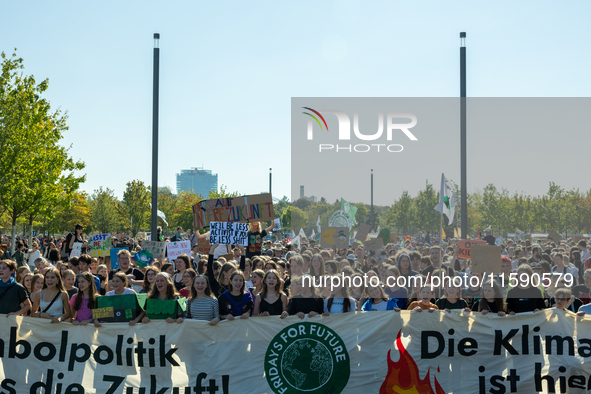 Protesters march during the global climate strike organized by Fridays for Future in Berlin, Germany, on September 20, 2024 