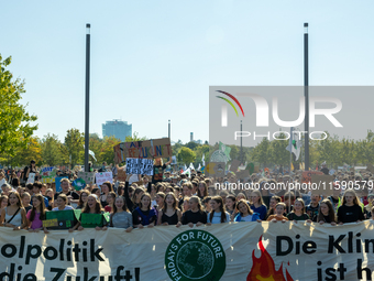 Protesters march during the global climate strike organized by Fridays for Future in Berlin, Germany, on September 20, 2024 (