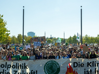 Protesters march during the global climate strike organized by Fridays for Future in Berlin, Germany, on September 20, 2024 (