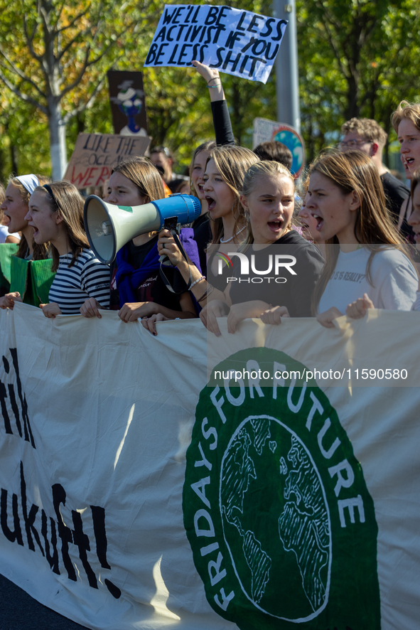 Protesters march during the global climate strike organized by Fridays for Future in Berlin, Germany, on September 20, 2024 