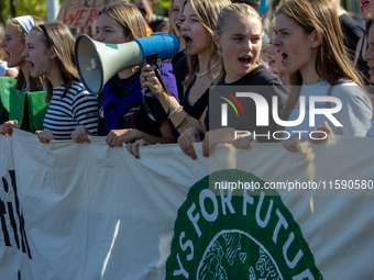 Protesters march during the global climate strike organized by Fridays for Future in Berlin, Germany, on September 20, 2024 (