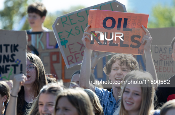 Protesters march during the global climate strike organized by Fridays for Future in Berlin, Germany, on September 20, 2024 