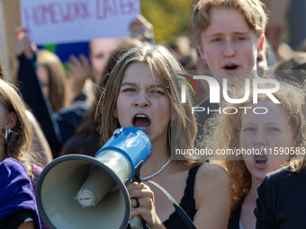 Protesters march during the global climate strike organized by Fridays for Future in Berlin, Germany, on September 20, 2024 (