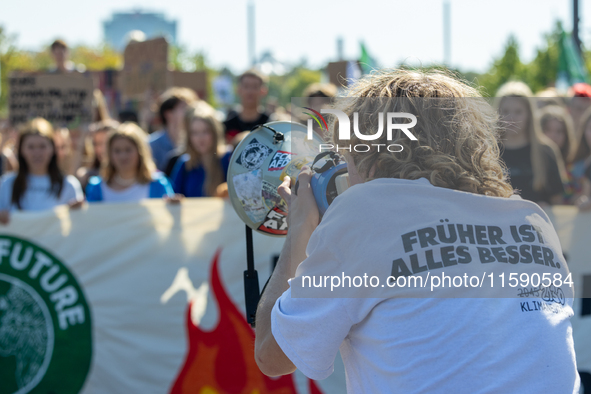 Protesters march during the global climate strike organized by Fridays for Future in Berlin, Germany, on September 20, 2024 