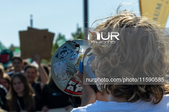 Protesters march during the global climate strike organized by Fridays for Future in Berlin, Germany, on September 20, 2024 