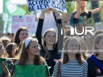 Protesters march during the global climate strike organized by Fridays for Future in Berlin, Germany, on September 20, 2024 (