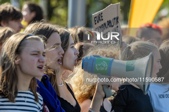 Protesters march during the global climate strike organized by Fridays for Future in Berlin, Germany, on September 20, 2024 