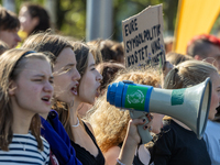 Protesters march during the global climate strike organized by Fridays for Future in Berlin, Germany, on September 20, 2024 (