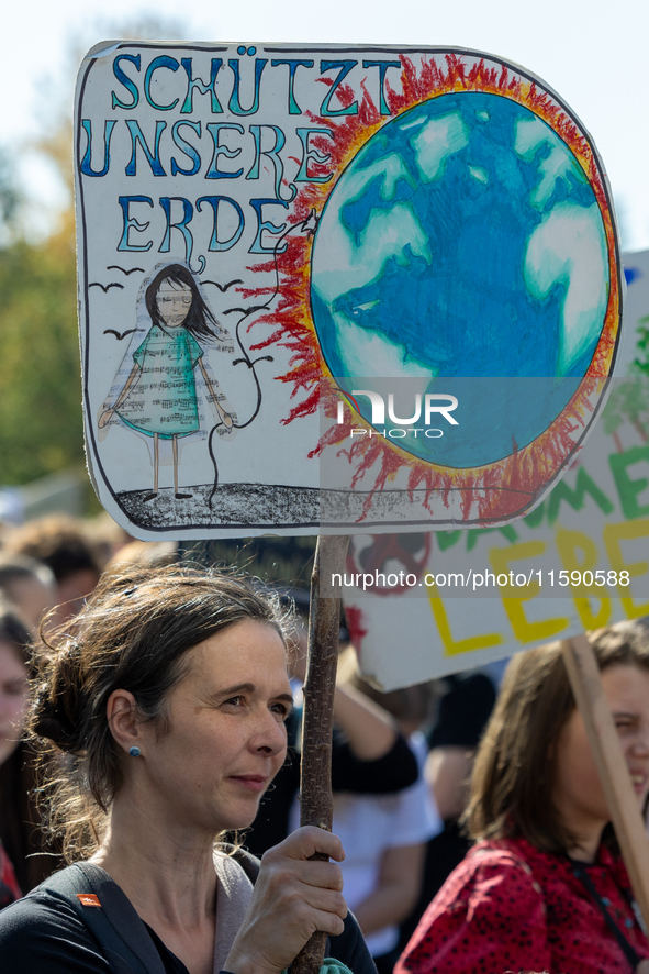 Protesters march during the global climate strike organized by Fridays for Future in Berlin, Germany, on September 20, 2024 