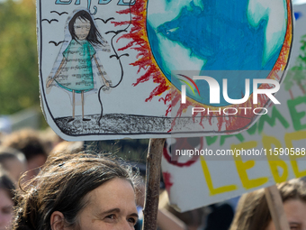 Protesters march during the global climate strike organized by Fridays for Future in Berlin, Germany, on September 20, 2024 (