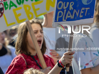 Protesters march during the global climate strike organized by Fridays for Future in Berlin, Germany, on September 20, 2024 (