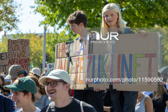 Protesters march during the global climate strike organized by Fridays for Future in Berlin, Germany, on September 20, 2024 