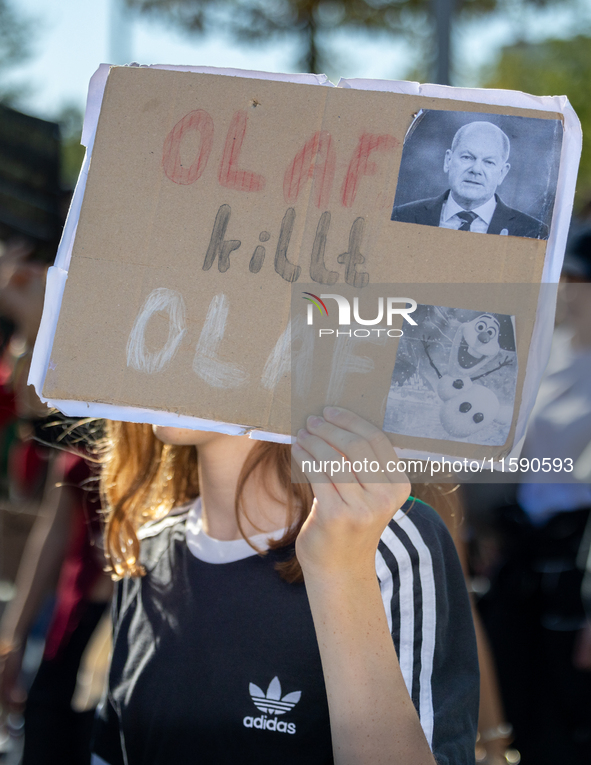 Protesters march during the global climate strike organized by Fridays for Future in Berlin, Germany, on September 20, 2024 